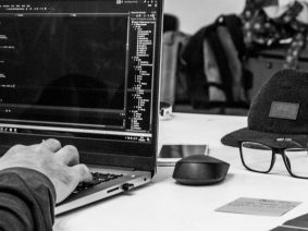 Developer writing code on a laptop