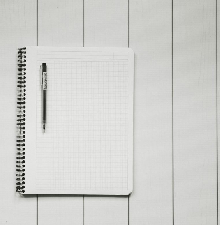 Technical SEO Checklist Before Launching a New Website Grid notebook and pen on a desk