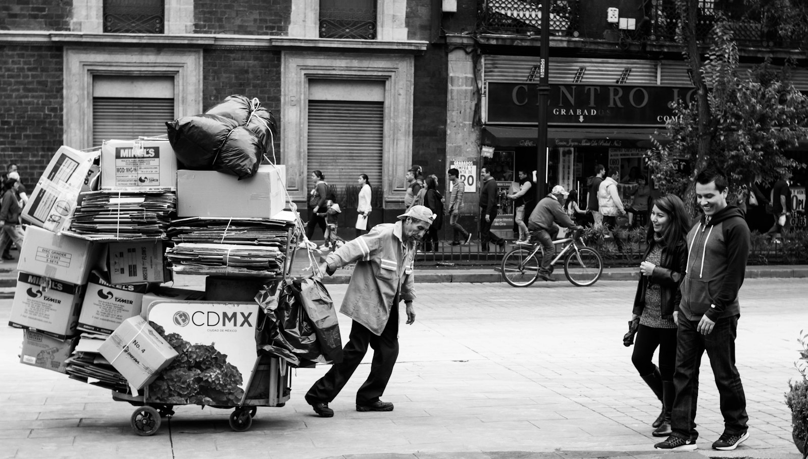 Man pulling a wagon with cardboard boxes